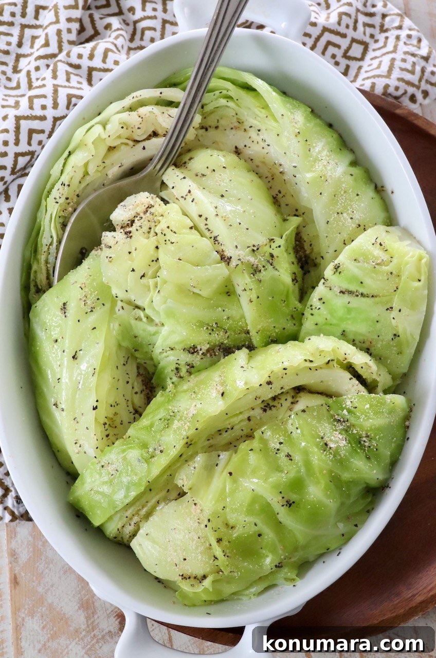 How to Make Tender Steamed Cabbage 2 steamed cabbage in serving dish with serving fork