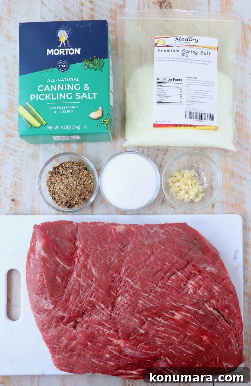 ingredients for homemade corned beef on white wood board