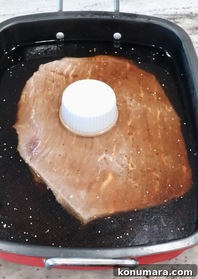 corned beef brining in roasting pan