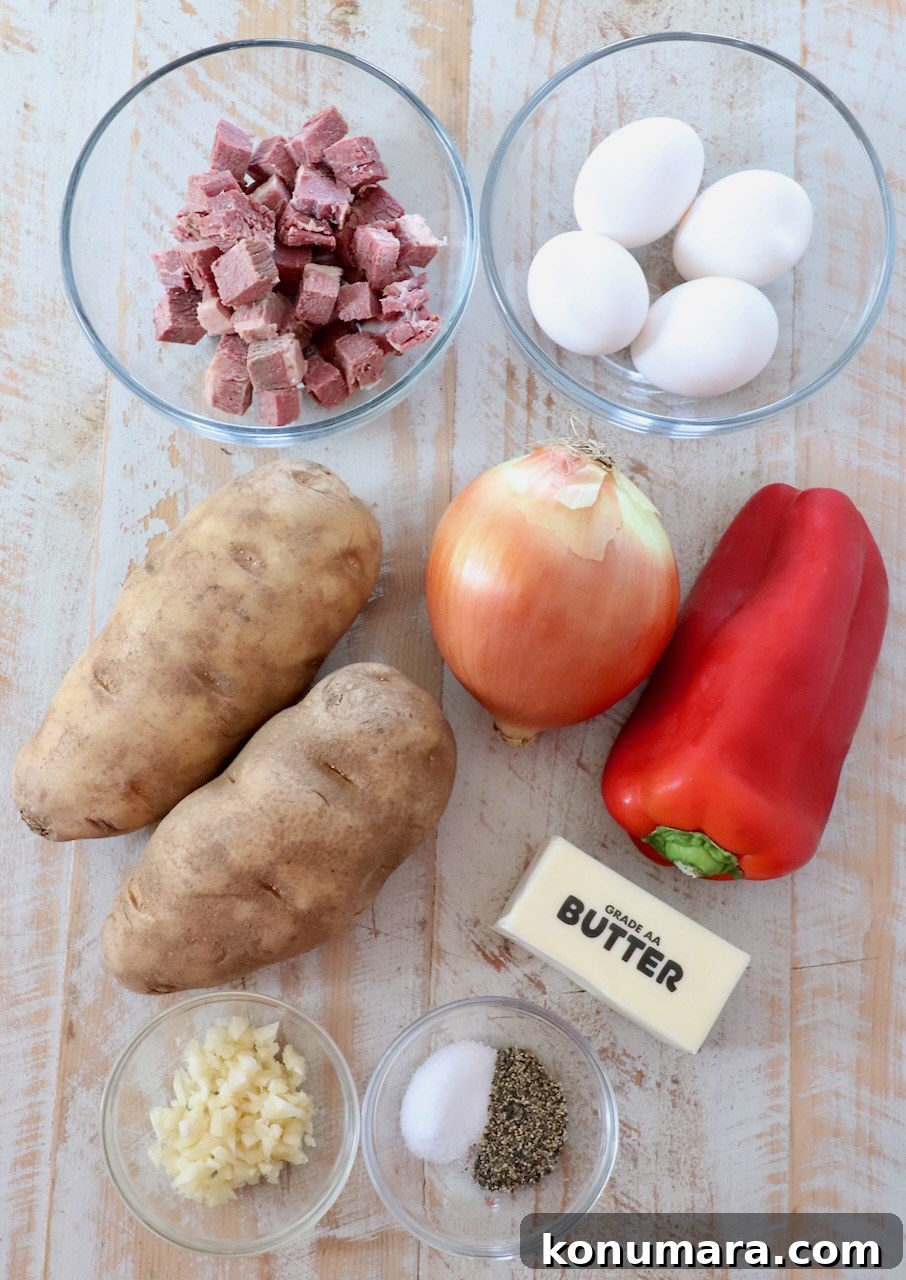 Corned Beef Hash with Crispy Potatoes 3 ingredients for corned beef hash on white wood board