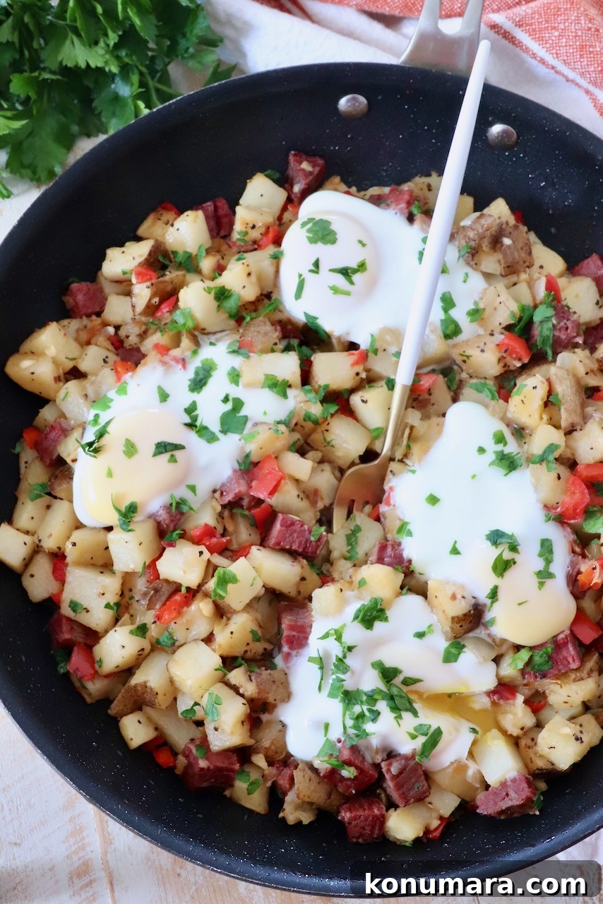 Corned Beef Hash with Crispy Potatoes 8 corned beef hash in skillet with fork