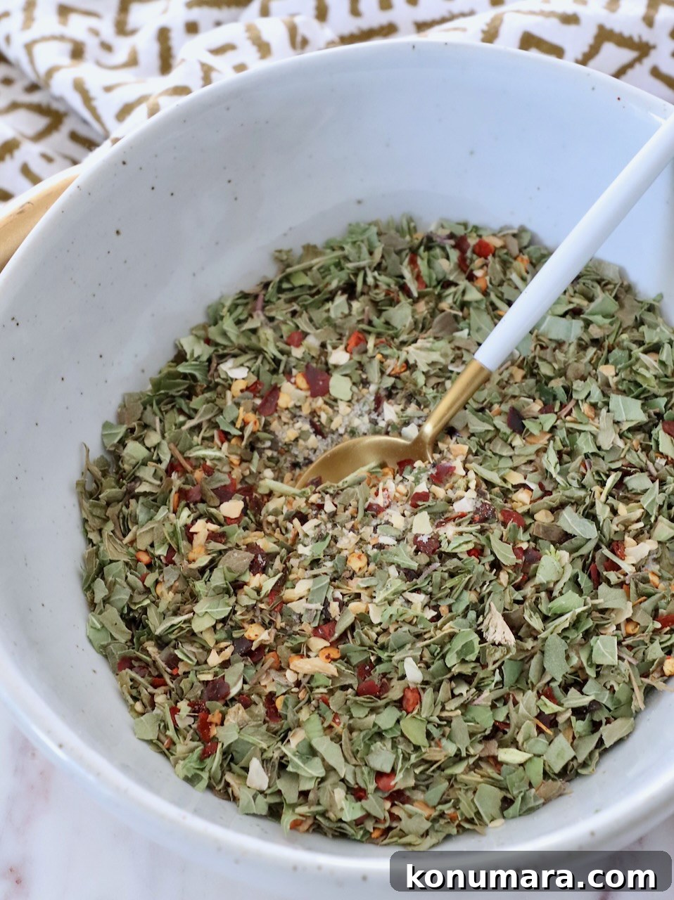 Homemade Italian Dressing Mix Recipe 2 herbs and spices combined in bowl with small spoon