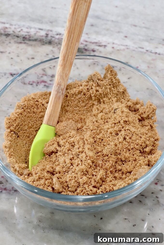 Honey-Baked Ham Recipe with Brown Sugar Glaze 7 brown sugar combined with spices in a bowl