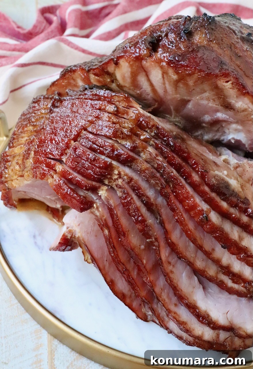 Honey-Baked Ham Recipe with Brown Sugar Glaze 10 sliced honey baked ham on marble serving tray