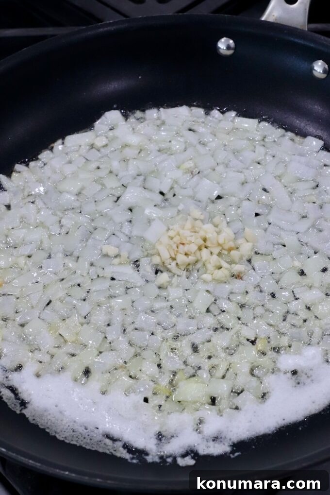 Creamy Garlic and Cheese Scalloped Potatoes Recipe 4 diced onions and minced garlic in skillet with melted butter