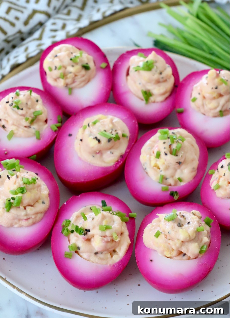 Vibrant Beet Deviled Eggs Recipe with Herbed Filling 8 beet deviled eggs on plate