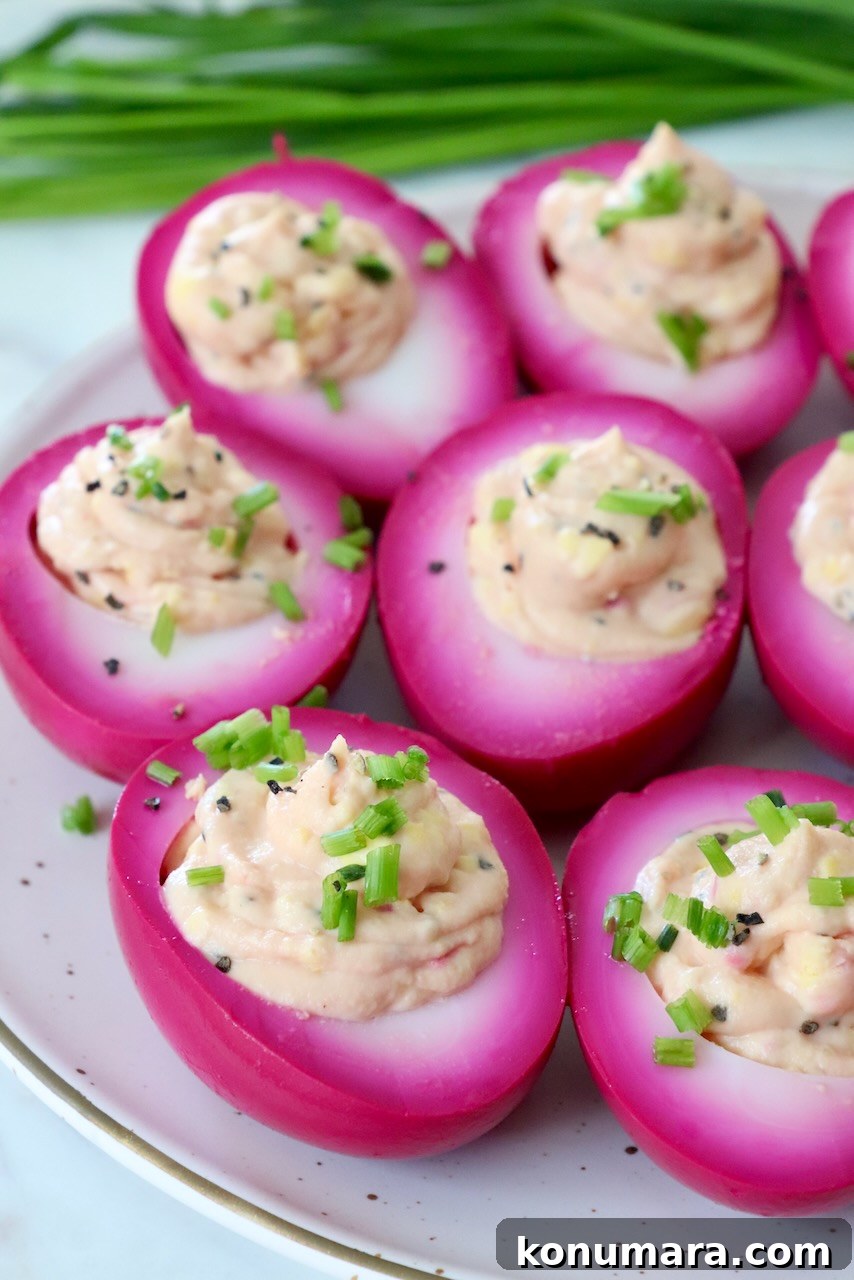 Vibrant Beet Deviled Eggs Recipe with Herbed Filling 9 beet pickled deviled eggs on plate