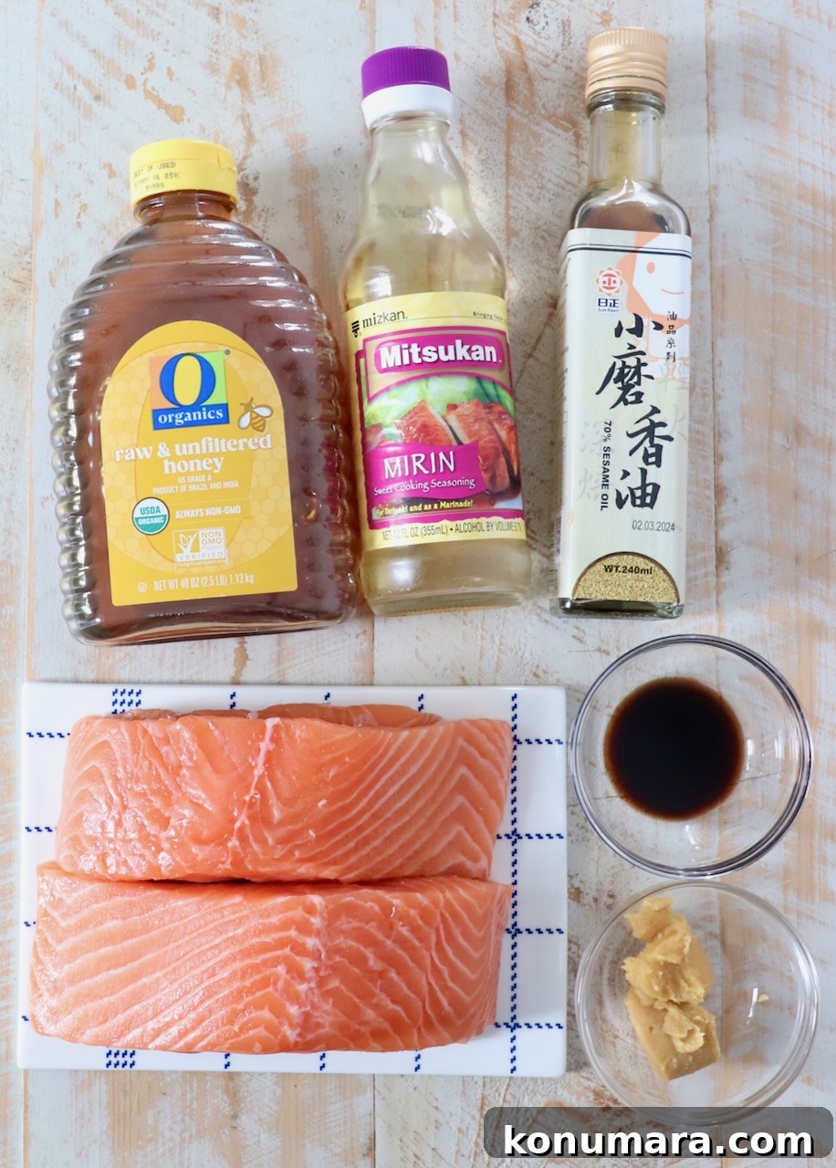 ingredients for miso glazed salmon on white wood board
