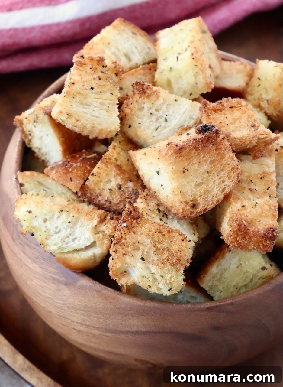 How to Make Crispy Homemade Croutons 2 croutons in wood bowl