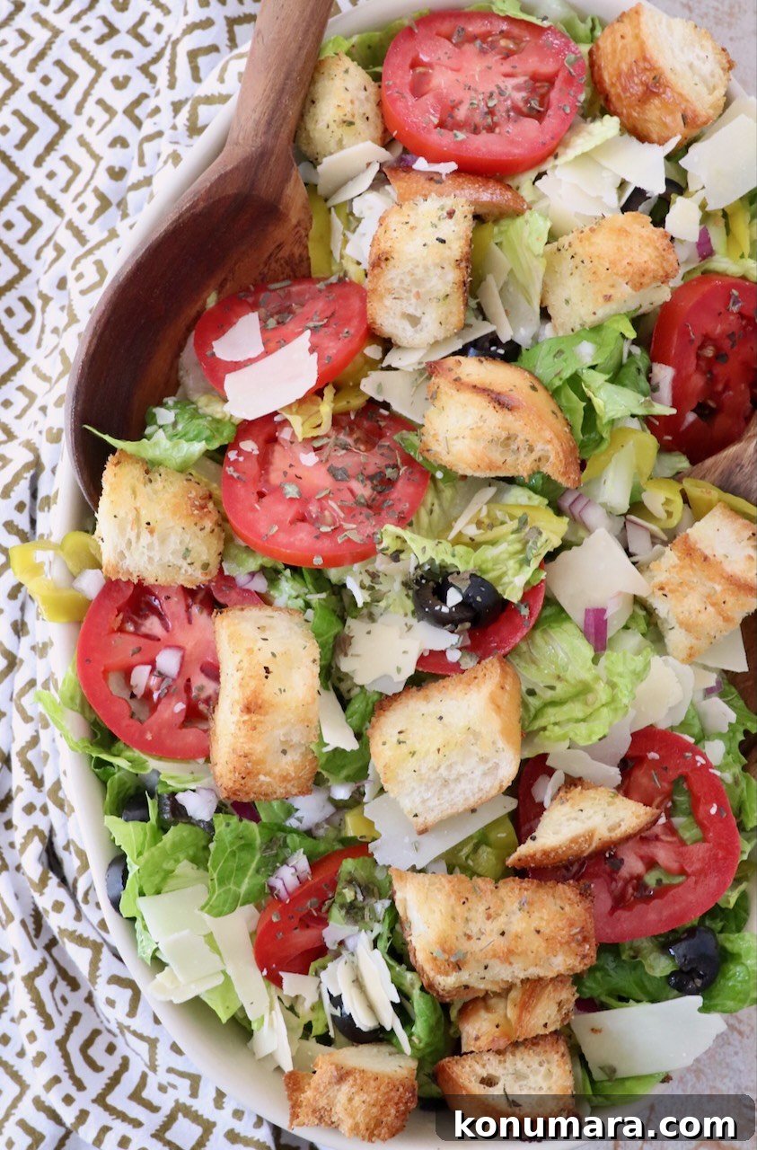 How to Make Crispy Homemade Croutons 6 salad in large serving bowl with serving spoon