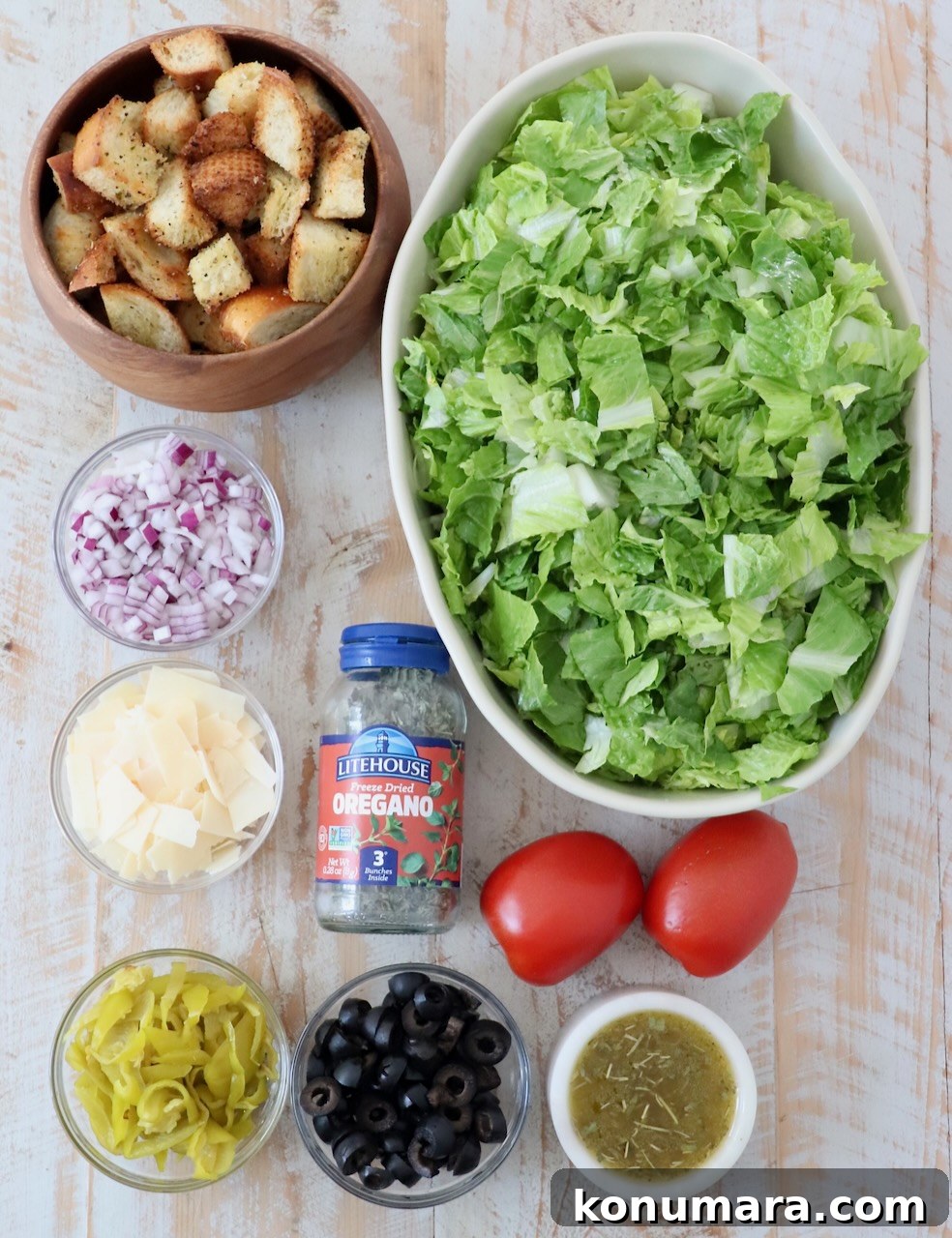 Italian Salad Recipe with Fresh Mozzarella and Herbs 3 ingredients for Italian salad on white wood board