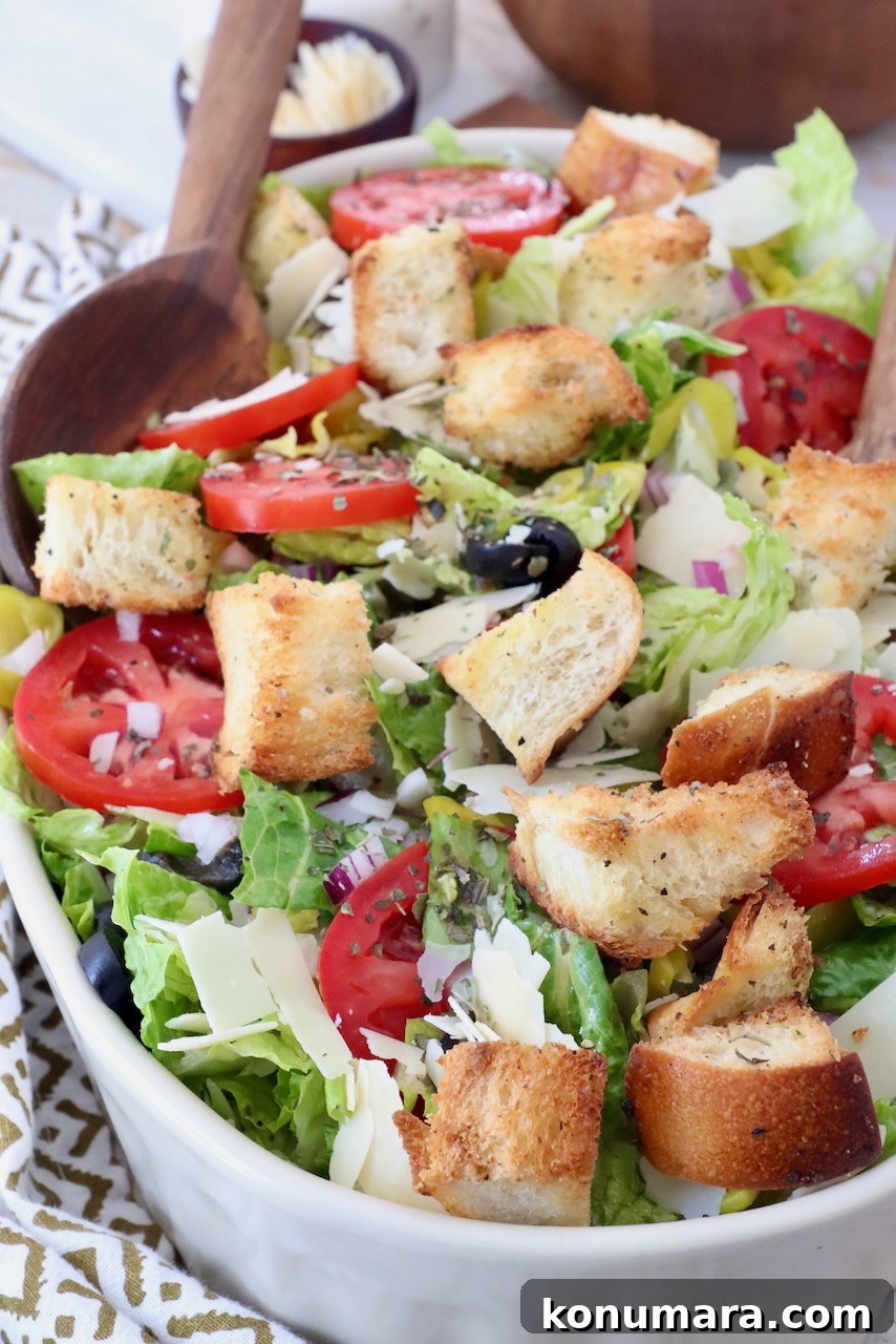 Italian Salad Recipe with Fresh Mozzarella and Herbs 4 Italian salad in bowl with serving spoon
