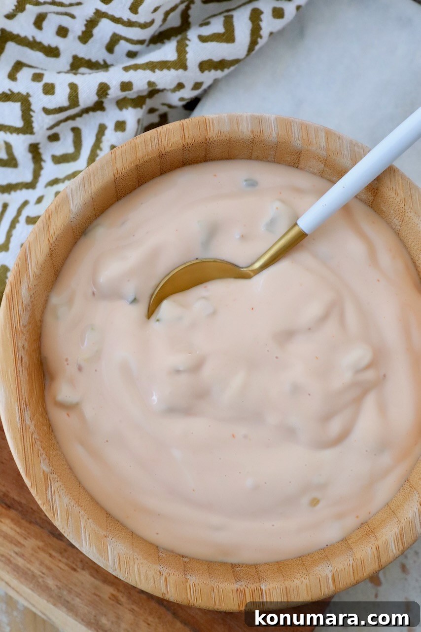 Classic Burger Sauce Recipe for Juicy Homemade Burgers 7 burger sauce in bowl with small spoon
