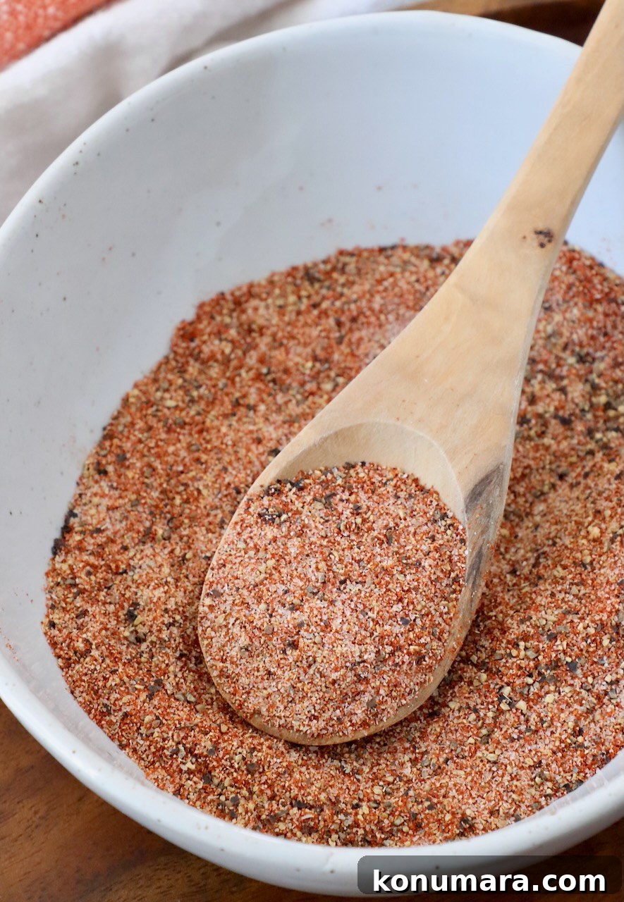 Homemade Hamburger Seasoning Mix for Juicy Burgers 2 burger seasoning in bowl with wooden spoon