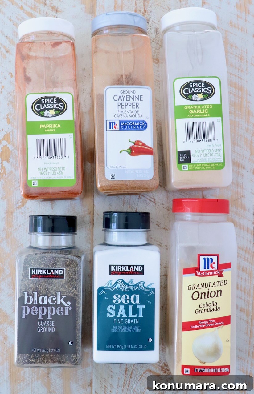 Homemade Hamburger Seasoning Mix for Juicy Burgers 5 ingredients for burger seasoning on white wood board