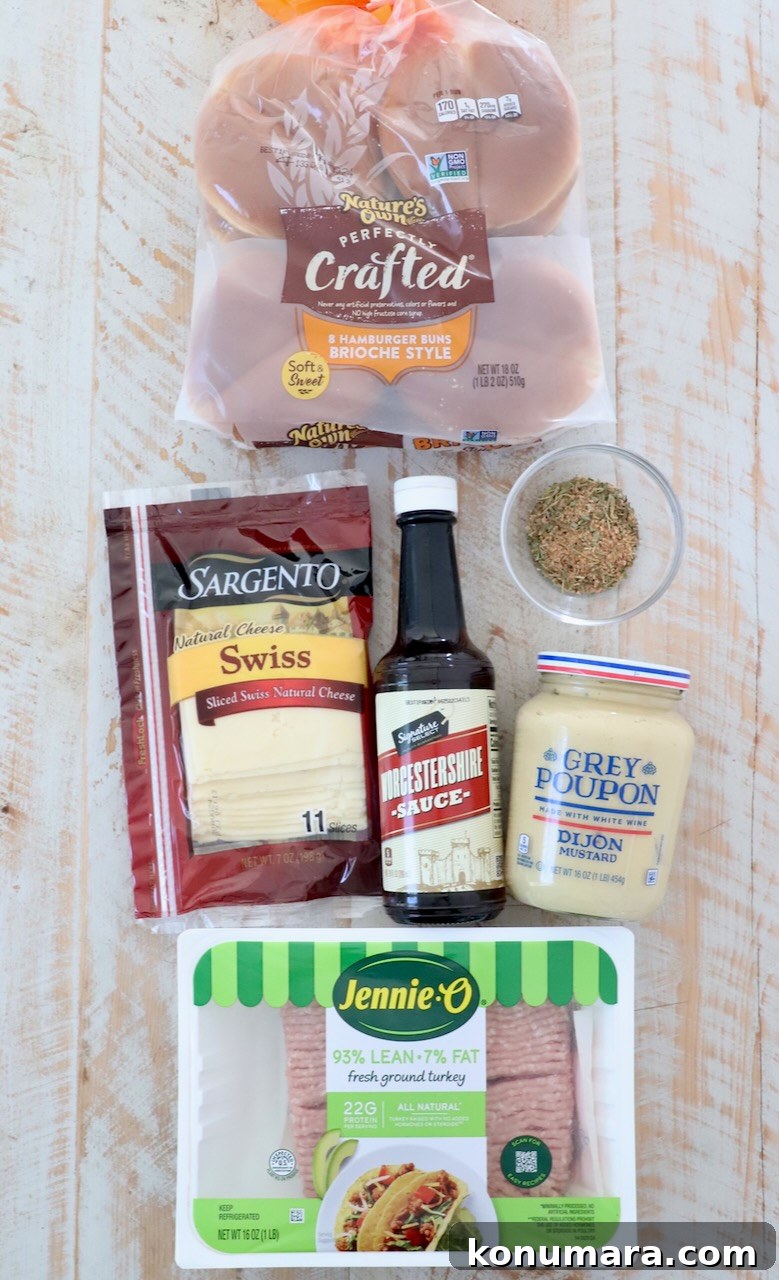 Juicy Turkey Burger Recipe with Savory Seasoning 3 ingredients for turkey burgers on white wood board