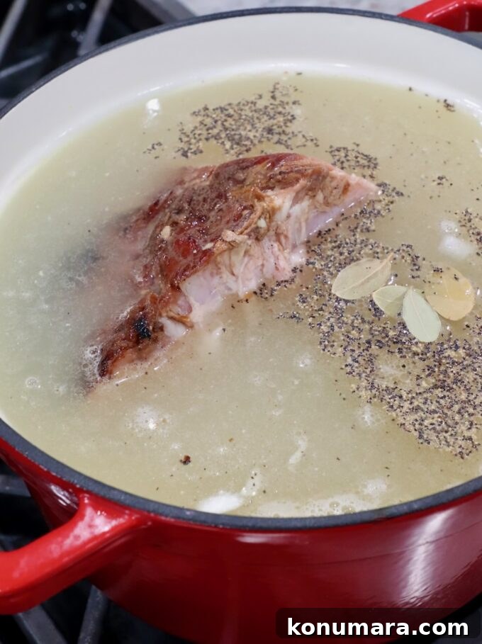 ham bone in pot with broth and spices