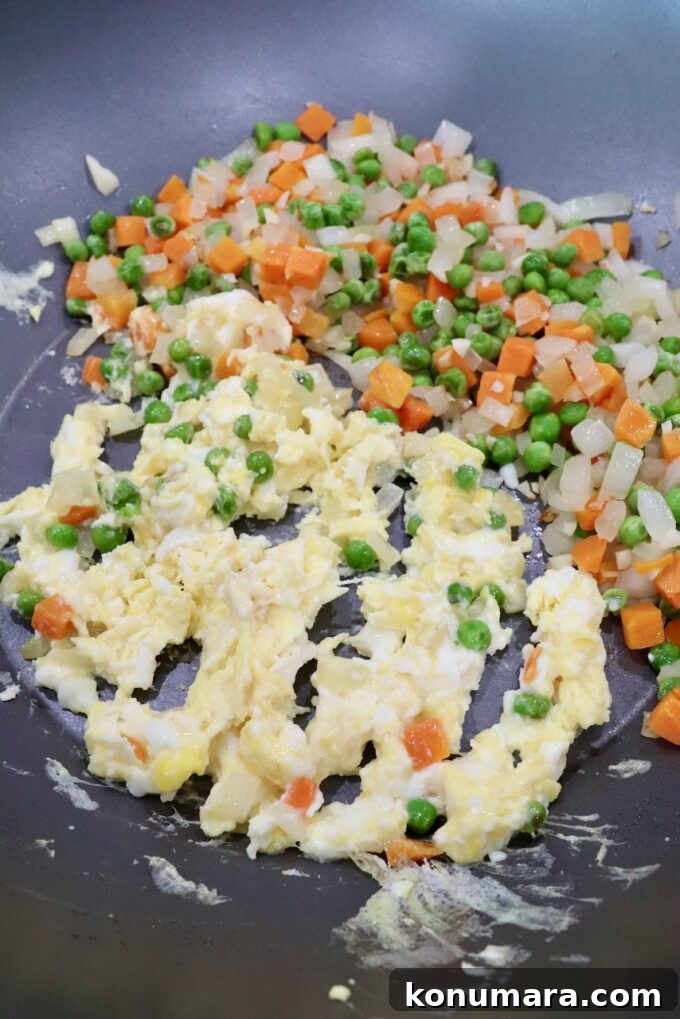 Classic Ham Fried Rice Recipe with Eggs and Peas 5 diced veggies and scrambled eggs in large skillet