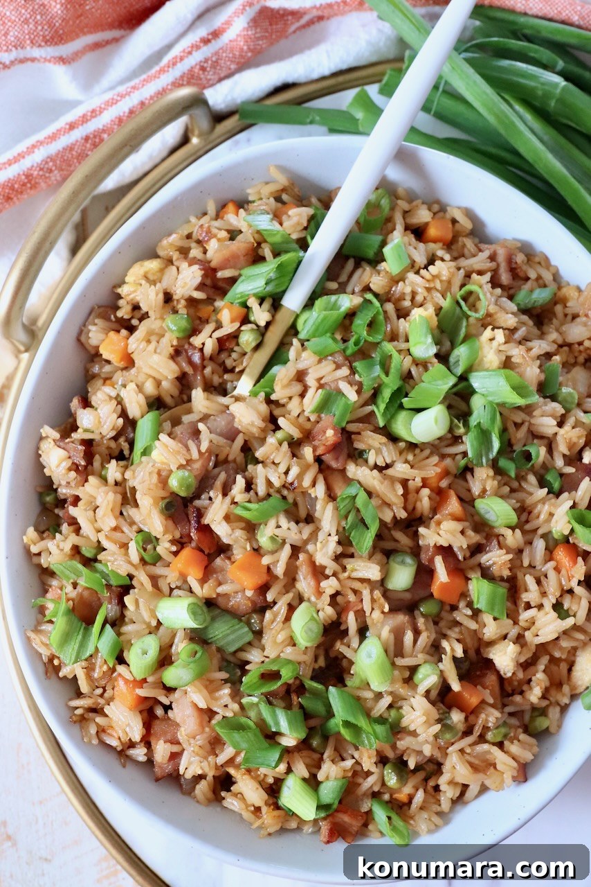 Classic Ham Fried Rice Recipe with Eggs and Peas 9 ham fried rice in bowl with spoon