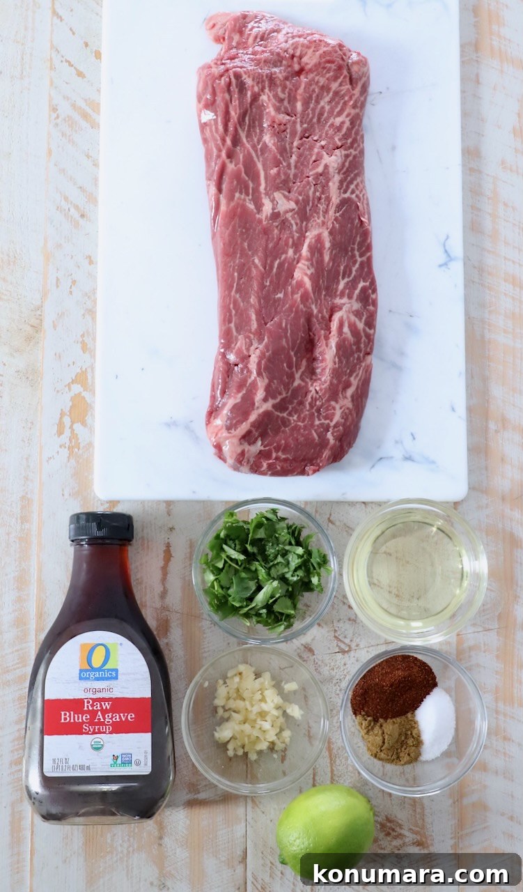 Grilled Flat Iron Steak Tacos with Cilantro Lime Slaw 3 flat iron steak and marinade ingredients on white wood board