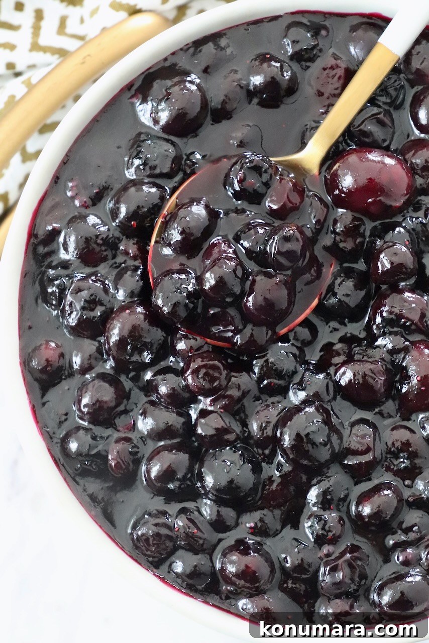 How to Make Homemade Blueberry Pie Filling 9 blueberry pie filling in bowl with spoon
