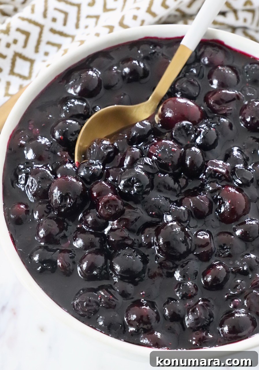 How to Make Homemade Blueberry Pie Filling 10 blueberry pie filling in bowl with spoon