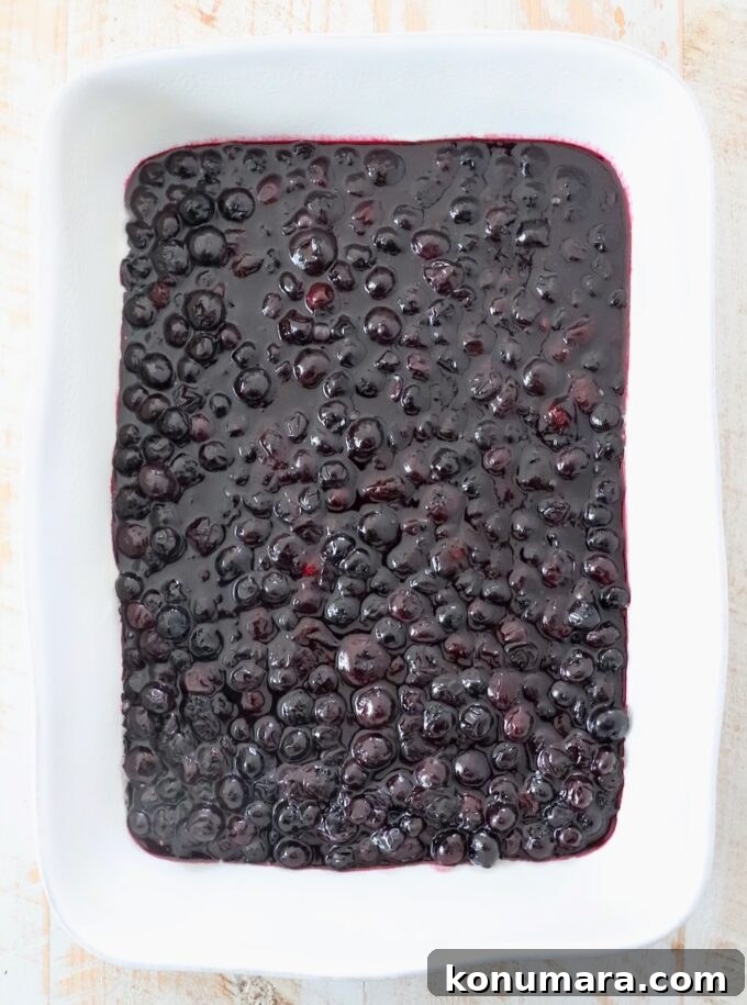 Blueberry Dump Cake Recipe: Irresistible Summer Dessert 4 blueberry pie filling in baking dish