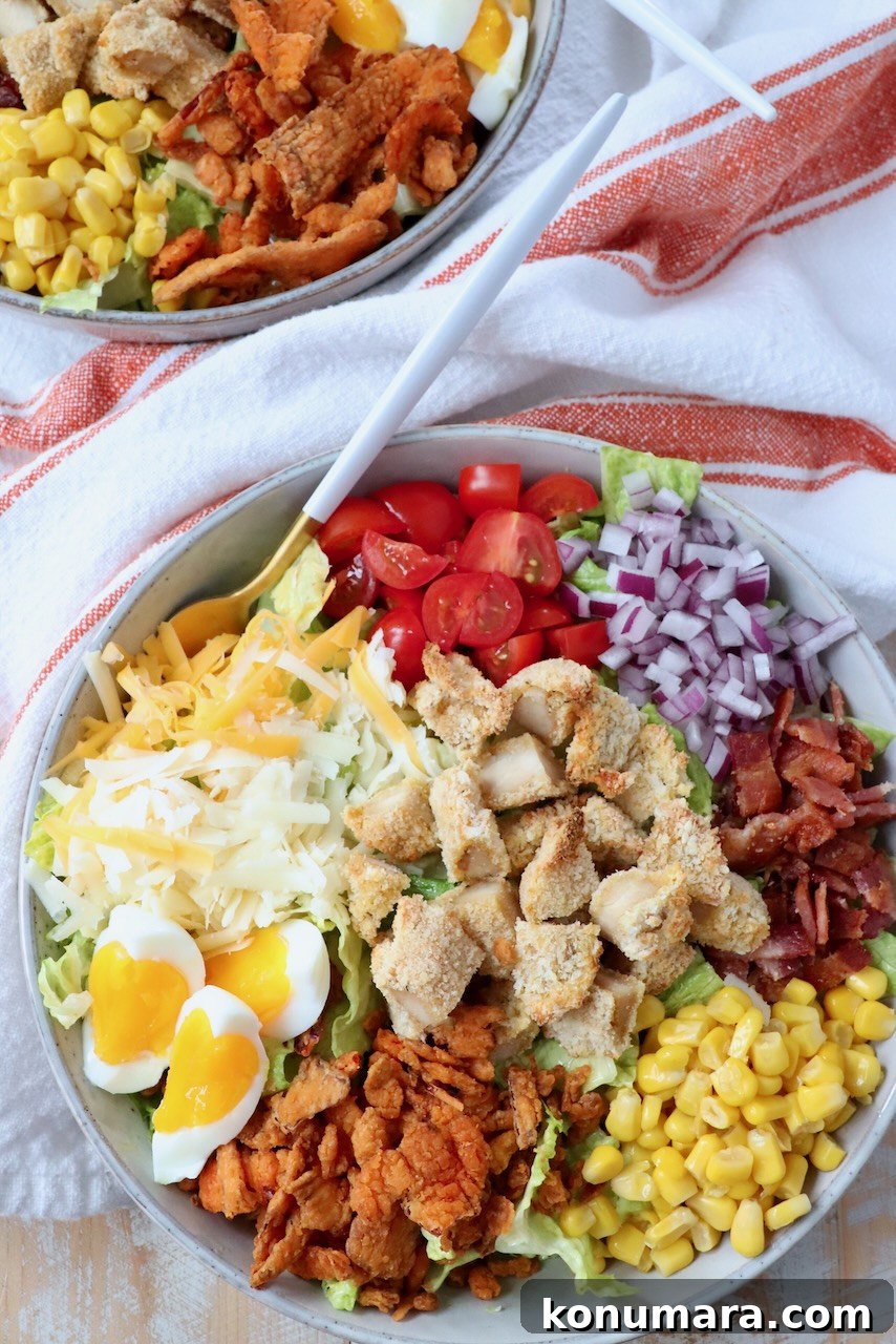 crispy chicken salad in bowl with fork