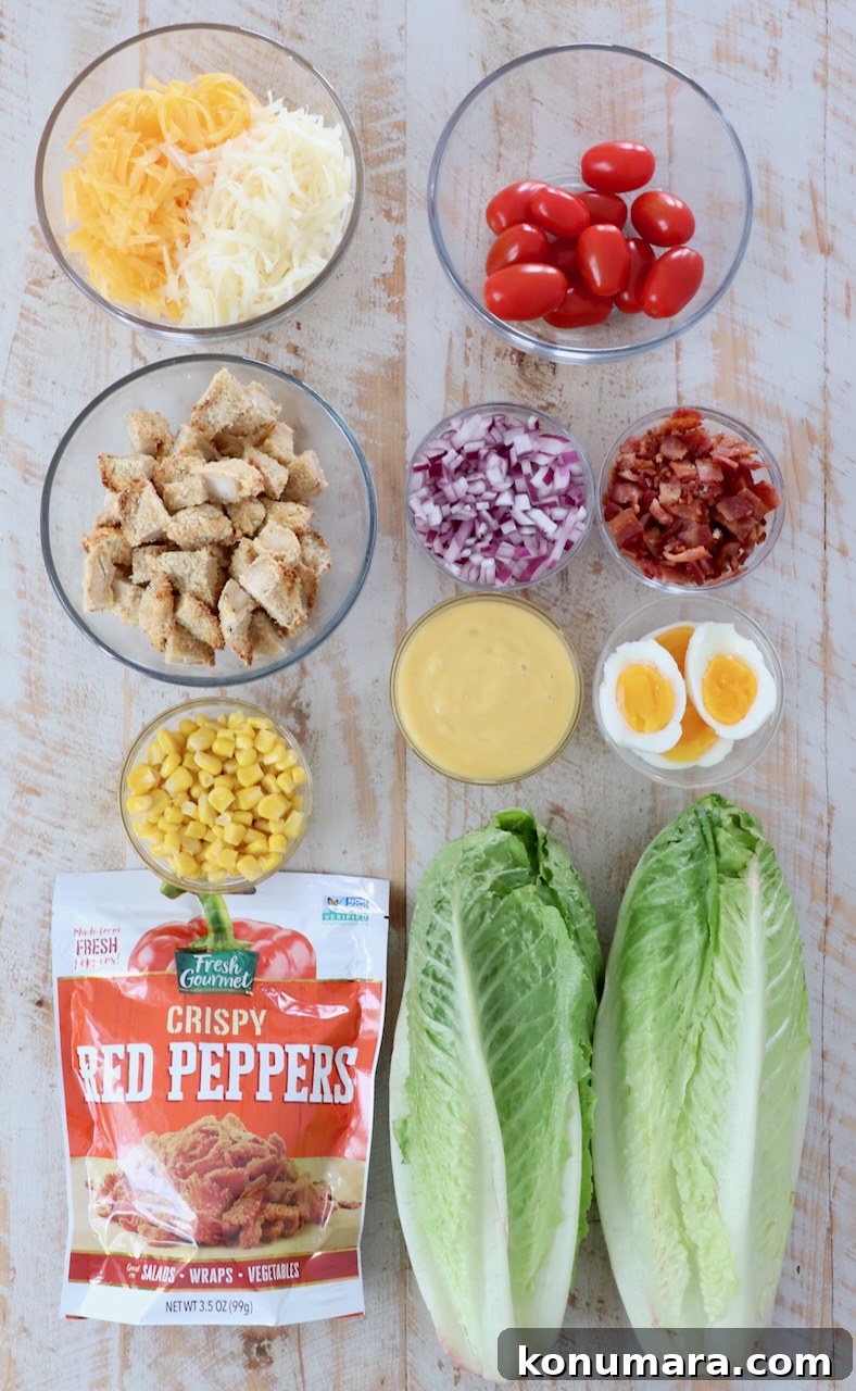 ingredients for crispy chicken salad on white wood board