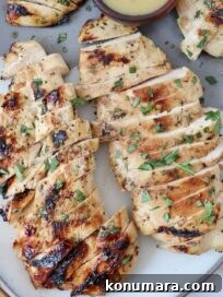 sliced grilled chicken on plate