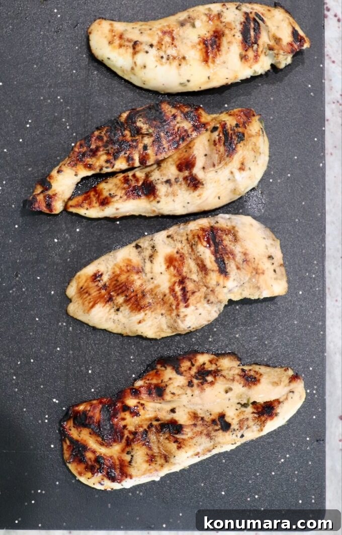 grilled chicken on cutting board