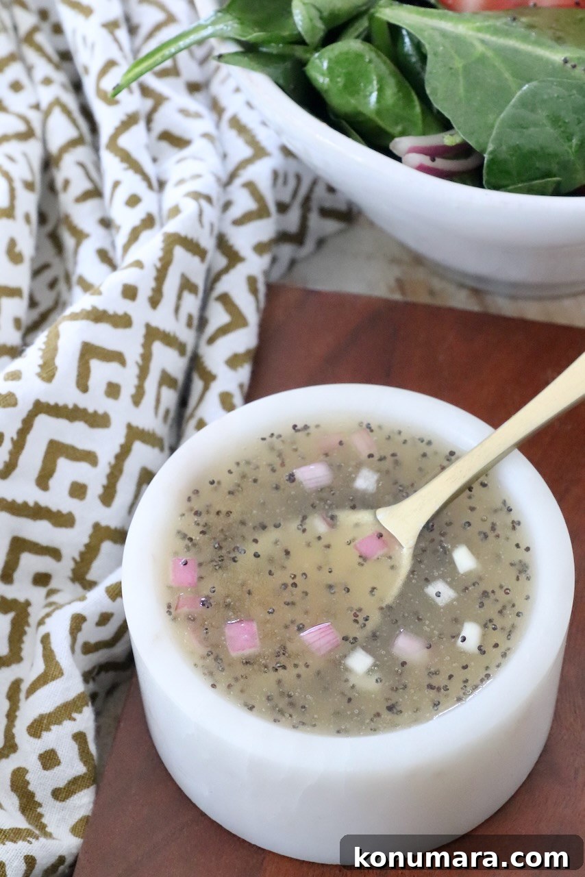 Homemade Creamy Poppy Seed Salad Dressing 2 poppy seed dressing in small bowl with spoon