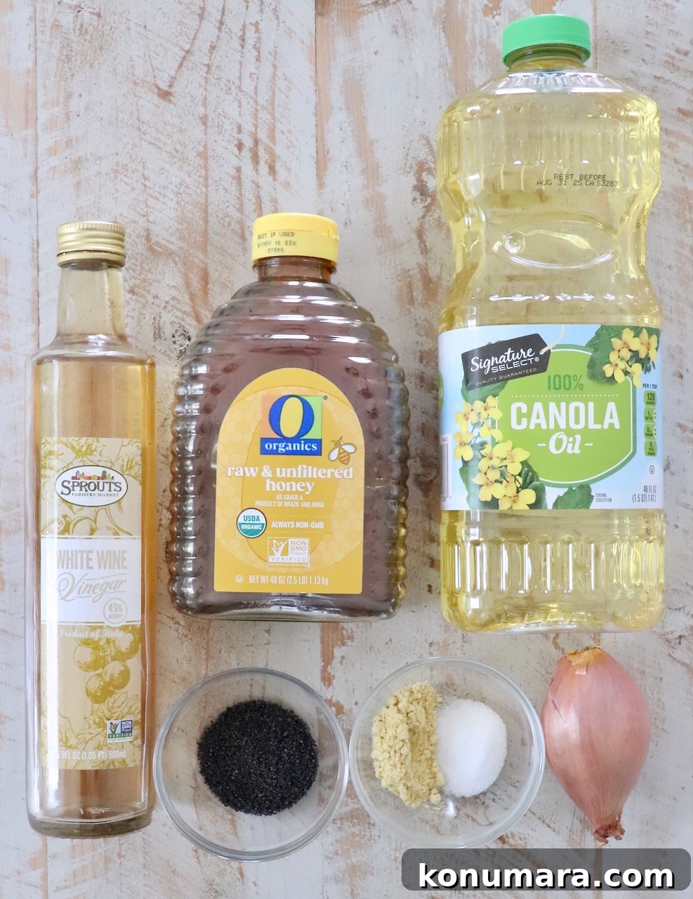 Homemade Creamy Poppy Seed Salad Dressing 3 ingredients for poppy seed dressing on white wood board