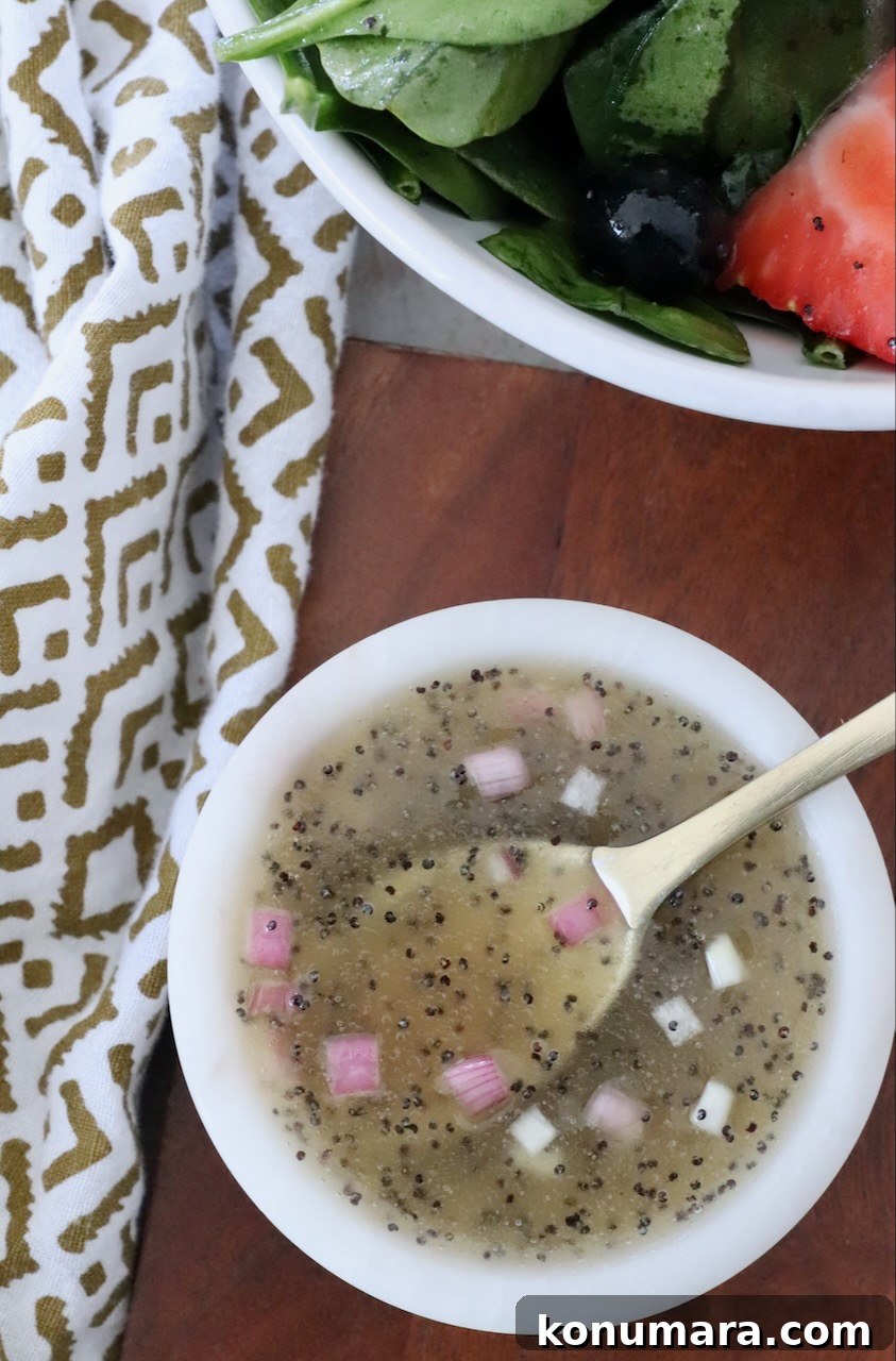Homemade Creamy Poppy Seed Salad Dressing 7 poppy seed dressing in small bowl with spoon