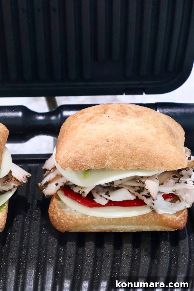 Grilled Turkey Pesto Sandwich with Melted Mozzarella 7 turkey sandwich inside an indoor grill