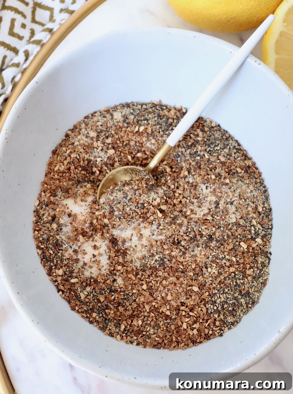 spices mixed together in bowl with small spoon