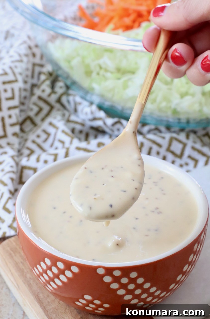 Homemade Creamy Coleslaw Dressing Recipe 2 coleslaw dressing in small bowl and spoon