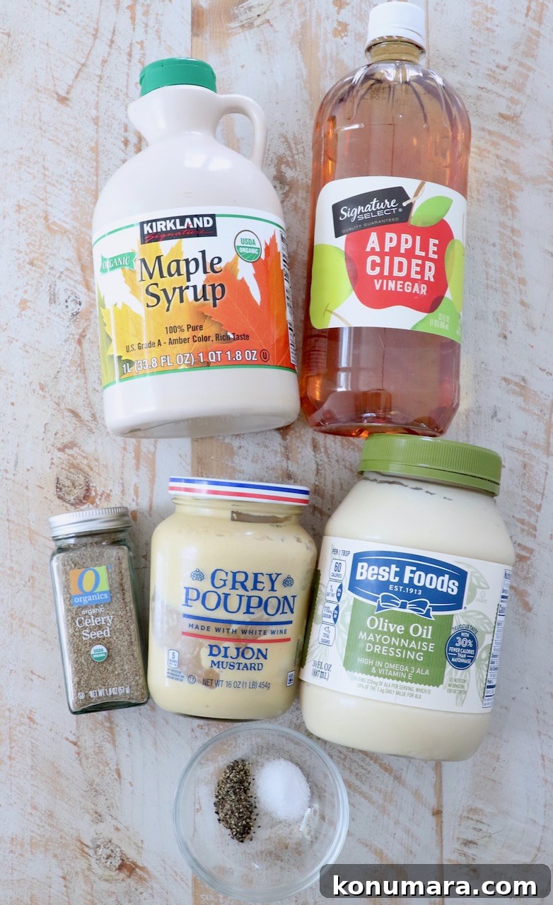 Homemade Creamy Coleslaw Dressing Recipe 3 coleslaw dressing ingredients on white wood board