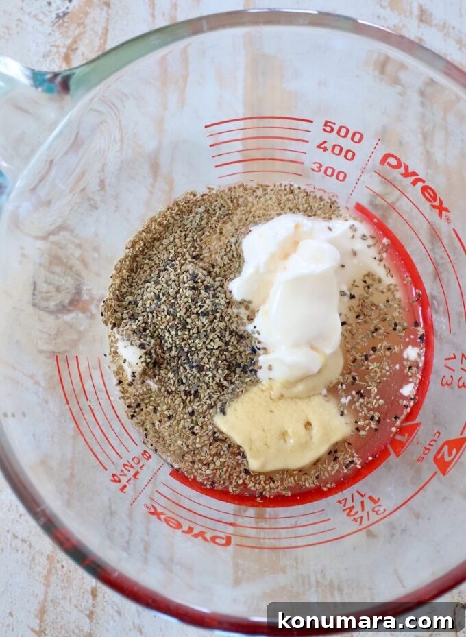 Homemade Creamy Coleslaw Dressing Recipe 4 ingredients for coleslaw dressing in glass measuring cup