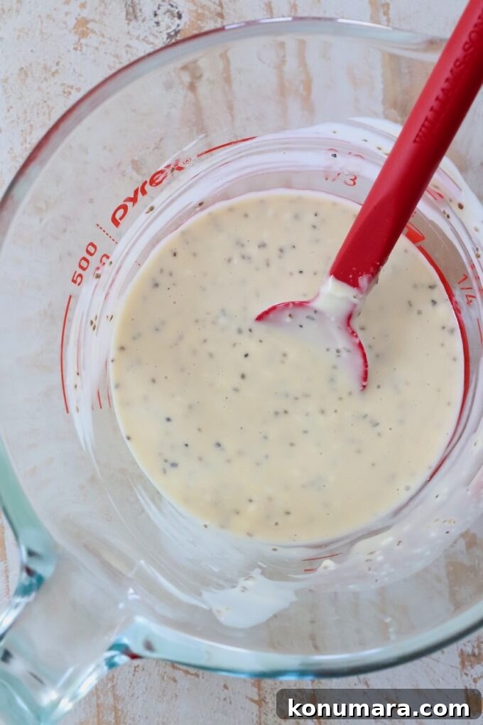 Homemade Creamy Coleslaw Dressing Recipe 5 coleslaw dressing in glass measuring cup with red spatula
