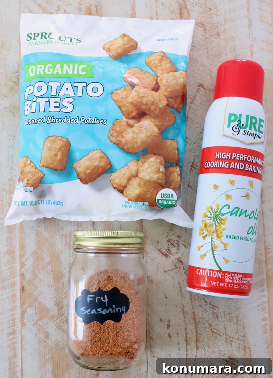 ingredients for air fryer tater tots on white wood board