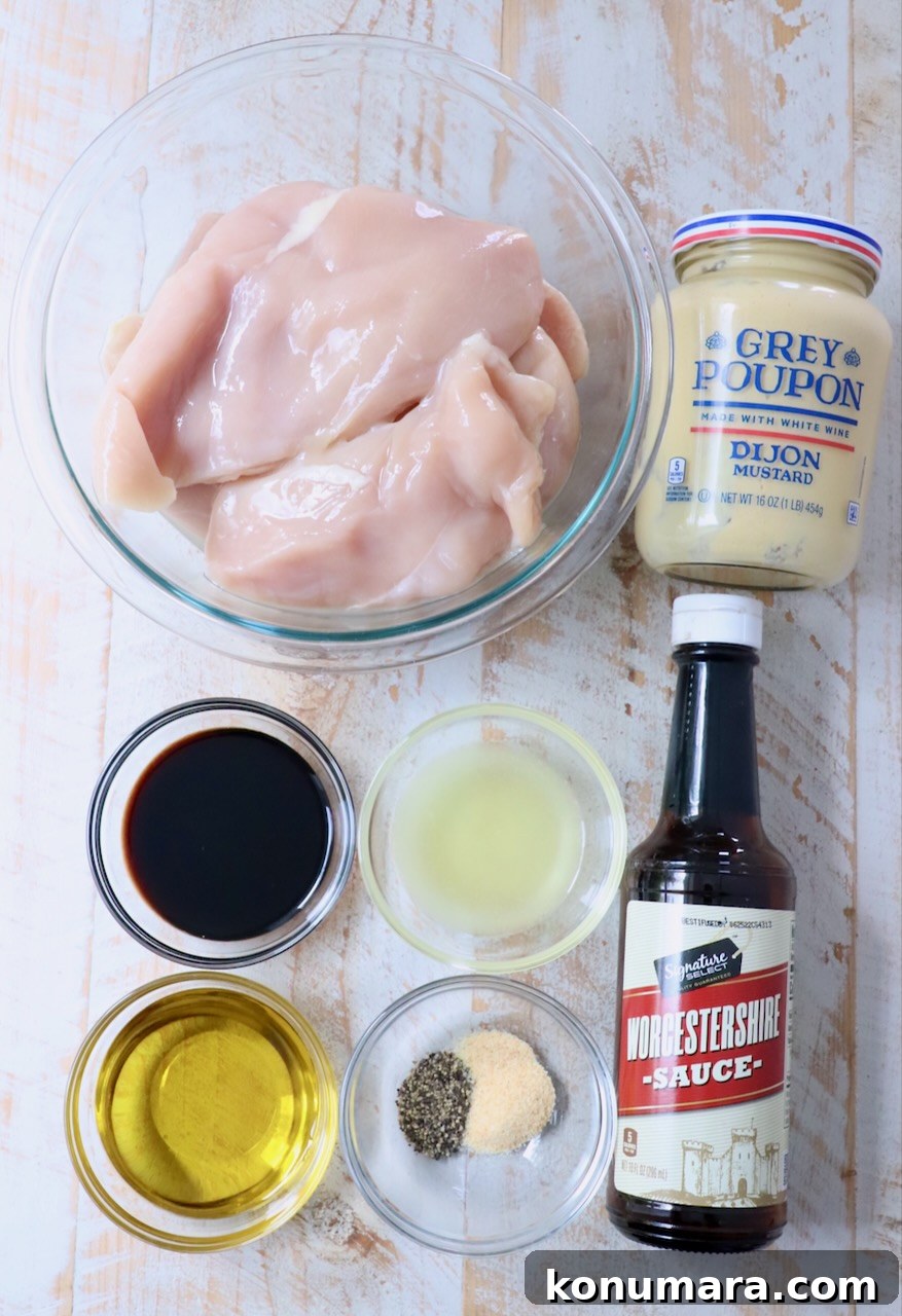 Garlic Lemon Chicken Marinade for Juicy Grilled Chicken 3 ingredients for chicken marinade on white wood board