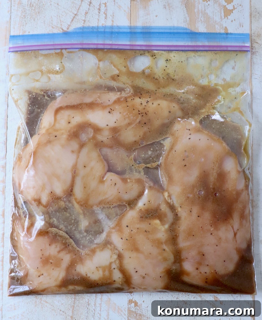 Garlic Lemon Chicken Marinade for Juicy Grilled Chicken 4 chicken breasts in plastic zipper bag with marinade