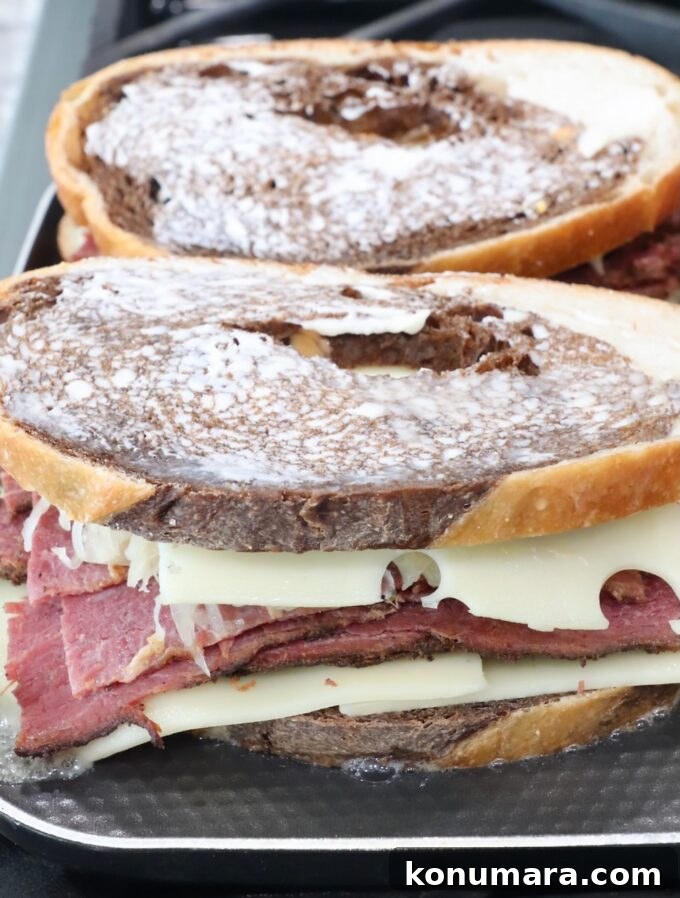 Classic New York Pastrami Sandwich Recipe 6 uncooked pastrami reuben sandwiches on griddle