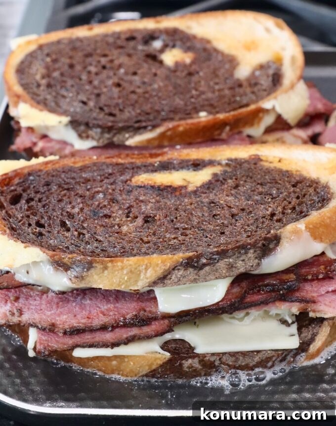 Classic New York Pastrami Sandwich Recipe 7 cooked pastrami reuben sandwiches on griddle