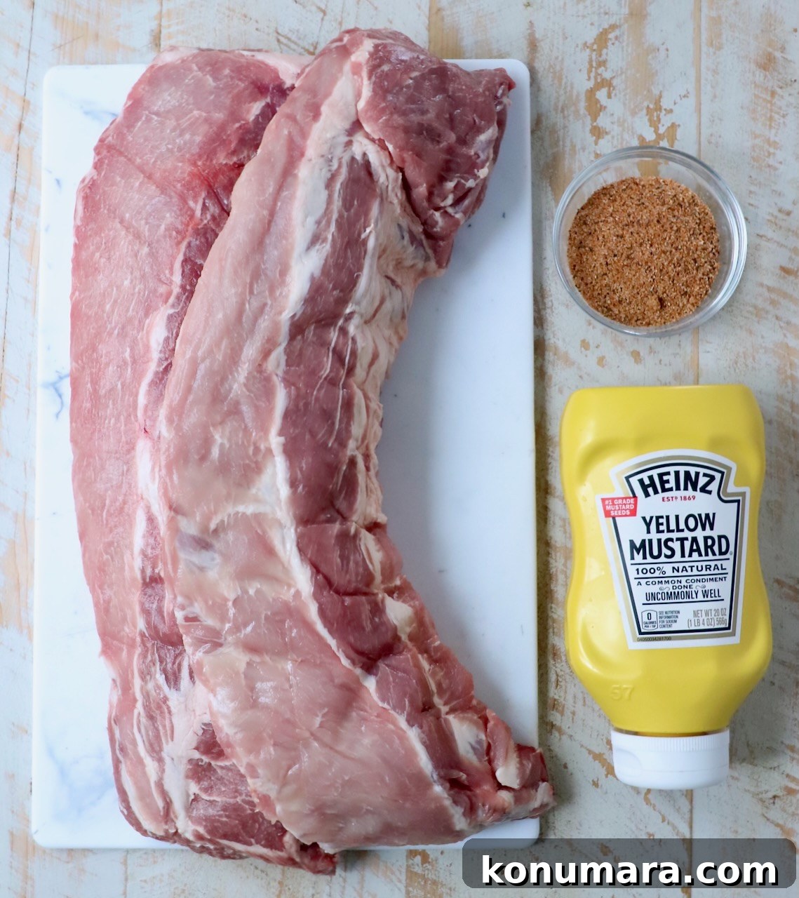 ingredients for smoked ribs on white wood board