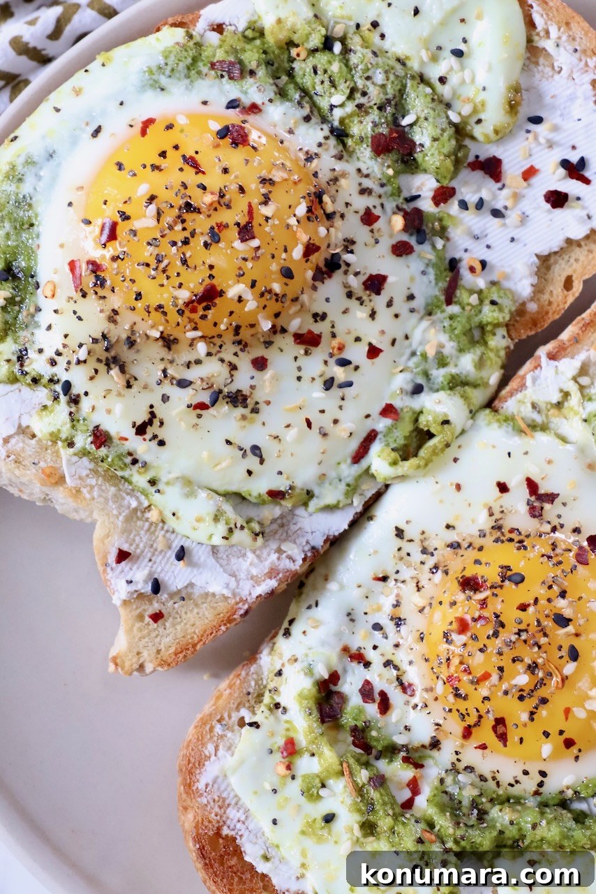 Creamy Pesto Scrambled Eggs with Parmesan 9 pesto eggs on toast on plate