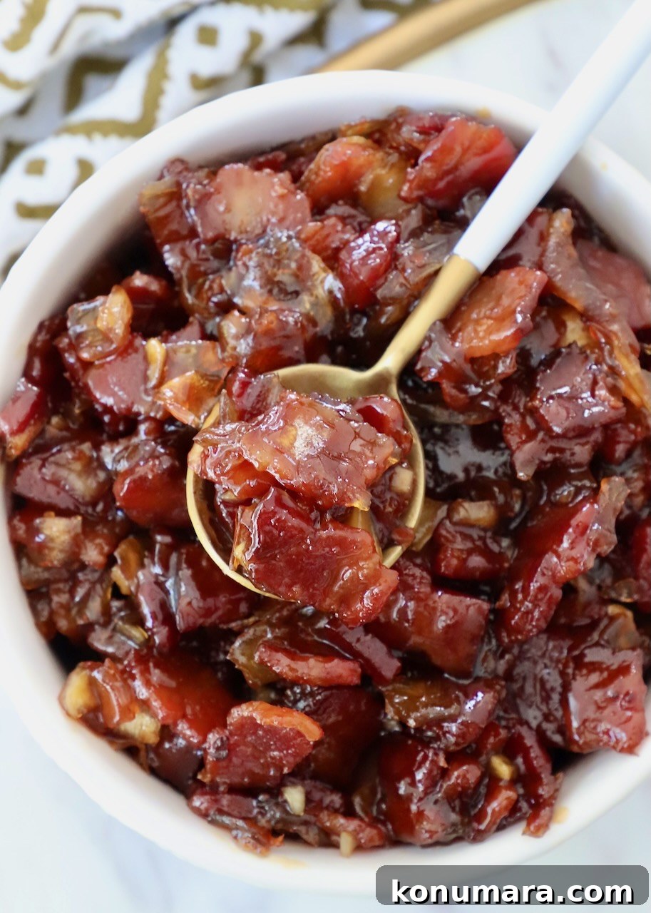 Bacon jam in a bowl with a spoon - bacon jam recipe