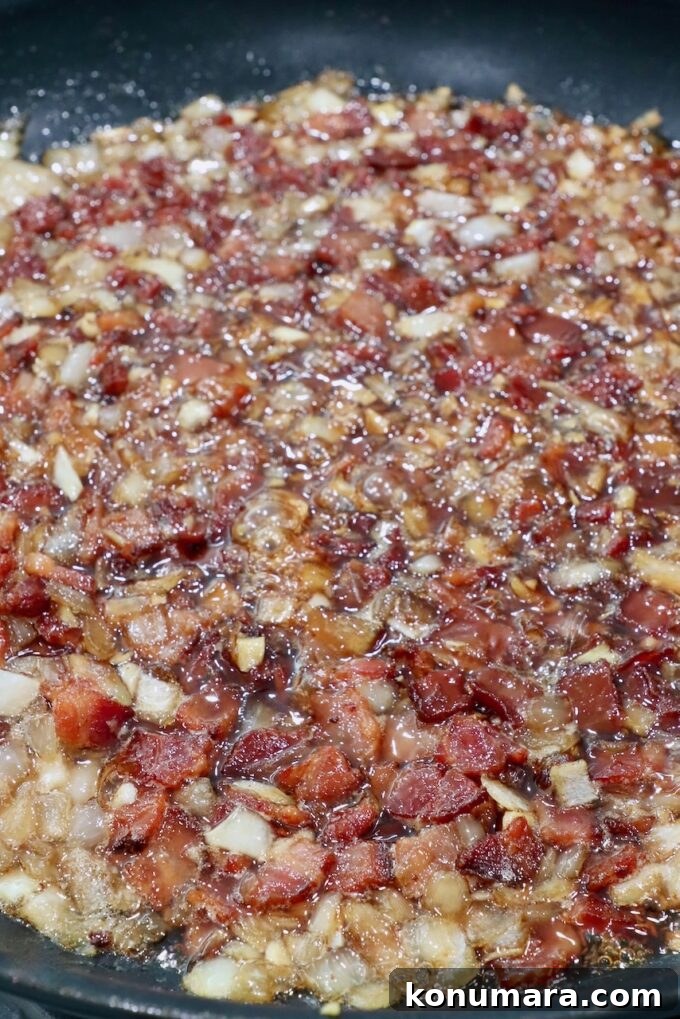 Bacon jam simmering in skillet