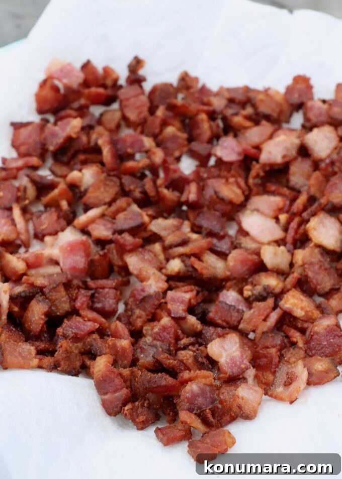 Cooked diced bacon on paper towel